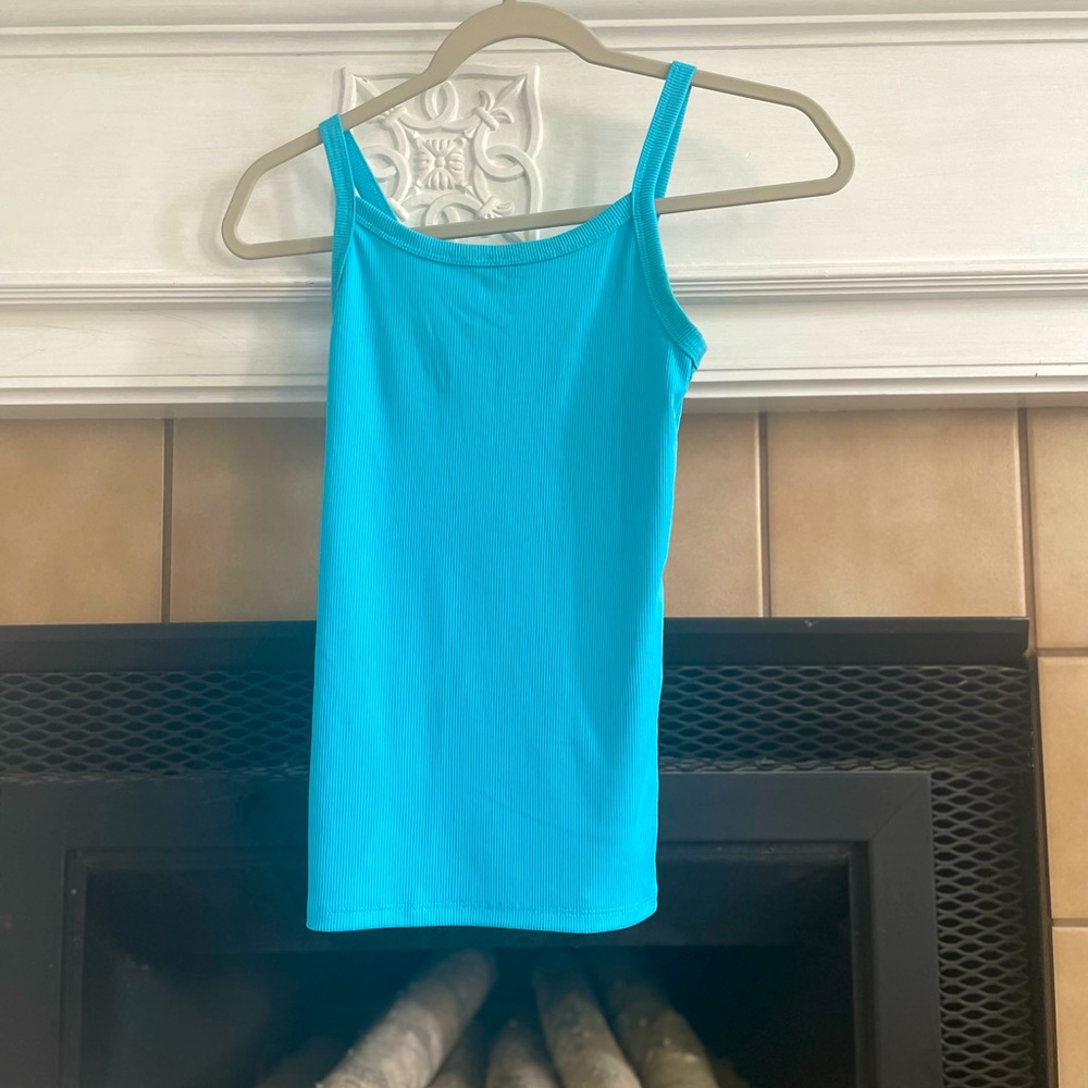 I am selling a tank top from target. The color is a brighter blue.